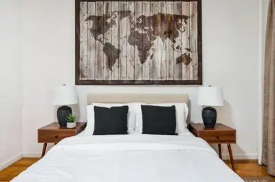a bedroom with a bed with a map on the wall at 109-1 Huge 3BR Best Value Amazing NYC Apt in New York