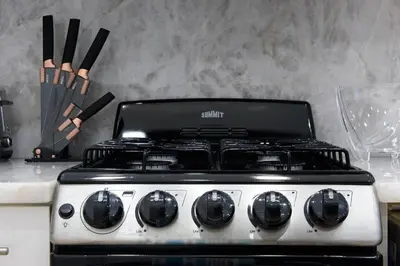 a stove top oven sitting on top of a counter at 62-2B NEW Prime UES W D in unit in New York