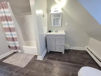a bathroom with a sink and a mirror at Room for rent in Apartment in Hartford