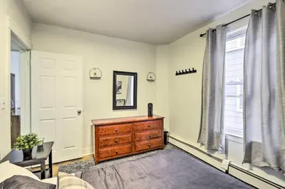 a bedroom with a dresser and a window at Hartford Vacation Rental - Close to Downtown! in Hartford