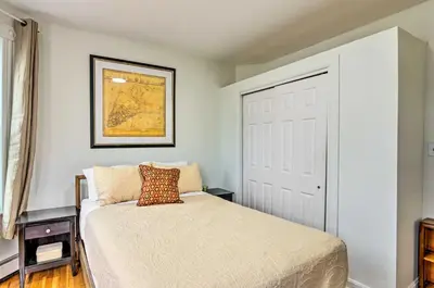 a small bedroom with a bed and a window at Hartford Vacation Rental - Close to Downtown! in Hartford
