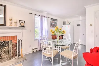 a dining room with a table and chairs and a fireplace at Elegant Connecticut Home Fireplaces, Pet Friendly in Trumbull