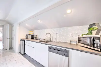 a kitchen with a sink and a microwave at Elegant Connecticut Home Fireplaces, Pet Friendly in Trumbull