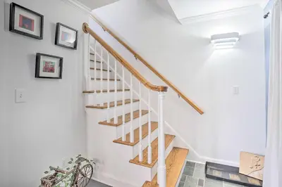a white staircase with wooden treads in a home at Elegant Connecticut Home Fireplaces, Pet Friendly in Trumbull