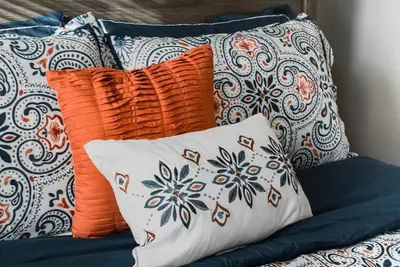 a pile of pillows sitting on a couch at Lovely 2BR apartment by Wooster Square- great neighborhood in New Haven