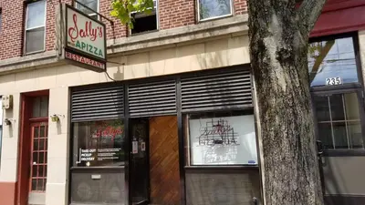 a store front of a building with a sign at Lovely 2BR apartment by Wooster Square- great neighborhood in New Haven
