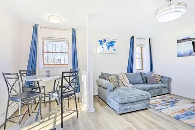 a living room with a couch and a table and chairs at New Paltz Apt - 11 Mi to Poughkeepsie! in New Paltz