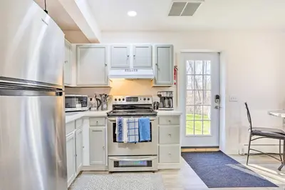 a kitchen with white cabinets and a stainless steel appliance at New Paltz Apt - 11 Mi to Poughkeepsie! in New Paltz