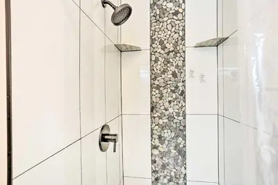 a bathroom with a shower with a glass door at New Paltz Apt - 11 Mi to Poughkeepsie! in New Paltz