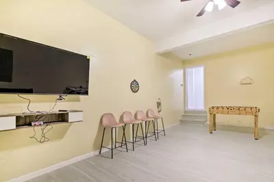 a room with stools and a table and a stage at 3 Mi to Kalahari Pocono Summit Home with Game Room! in Pocono Summit