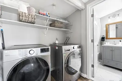 a laundry room with a washer and dryer at Lovely 3 Bedroom Colonial home in Middletown