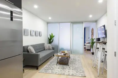 a living room with a couch and a table at 75-1C New 1BR prime UES W D the unit Best Value in New York