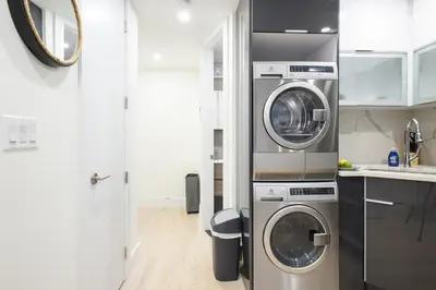 a kitchen with two washer and dryer in a room at 75-1C New 1BR prime UES W D the unit Best Value in New York