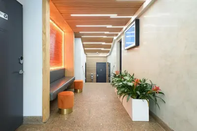 a corridor of an office with plants in a hallway at 75-1C New 1BR prime UES W D the unit Best Value in New York
