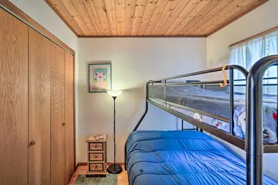 a bedroom with a bunk bed and a wooden ceiling at Berkshires Cabin 2 Mi to Appalachian Trail! in Otis