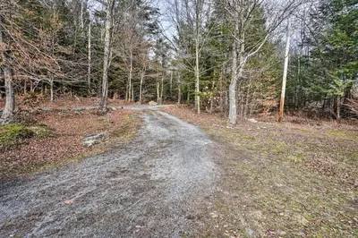 a dirt road in the middle of a forest at Berkshires Cabin 2 Mi to Appalachian Trail! in Otis