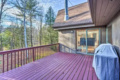 a porch with a purple deck on a house at Berkshires Cabin 2 Mi to Appalachian Trail! in Otis