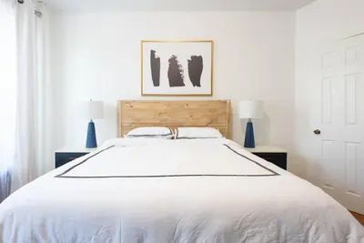 a bedroom with a large white bed with two lamps at 454-3W PRIME location 2BR Newly Furnished sleeps 5 in New York
