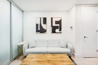 a living room with a couch and a table at 75-1A NEW Prime UES W D in unit Elevator in New York