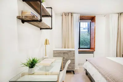 a bedroom with a glass table and a bed at 75-1A NEW Prime UES W D in unit Elevator in New York