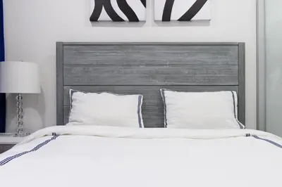 a large bed with white sheets and pillows at 75-1B NEW Prime Upper East W D Elevator in New York