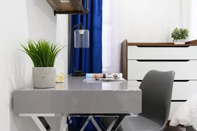 a white desk with a chair in a bedroom at 75-1B NEW Prime Upper East W D Elevator in New York