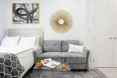 a living room with a bed and a couch at 62-3A NEW Prime UES W D in unit Walk 2 C park in New York