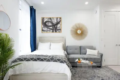 a bedroom with a bed and a couch at 62-3A NEW Prime UES W D in unit Walk 2 C park in New York