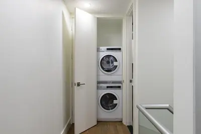 a laundry room with two washer and dryer at 75-3C Brand New Duplex 3BR W D in the unit in New York