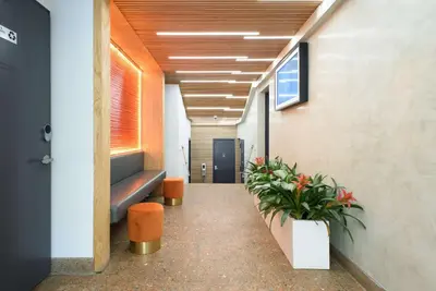 a corridor of an office with plants in a hallway at 75-3C Brand New Duplex 3BR W D in the unit in New York