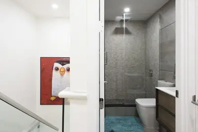 a bathroom with a painting of an owl on the wall at 75-3B 3BR Luxury duplex BRAND NEW &D Elevator in New York