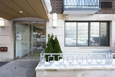 a christmas tree in front of a building at 75-4A Brand new 3BR Prime UES W D in unit in New York