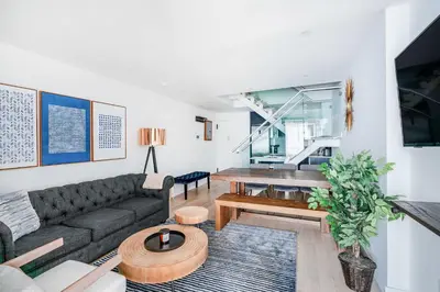 a living room with a couch and a table at 75-4A Brand new 3BR Prime UES W D in unit in New York