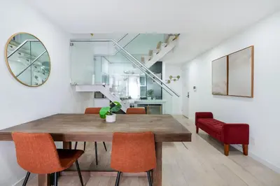 a dining room with a wooden table and chairs at 75-4B Duplex 3BR Brand new W D Prime UES in New York
