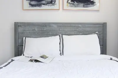 a bed with white sheets and two pillows at 75-5 Luxury 3BR Duplex W d Elevator bldg in New York