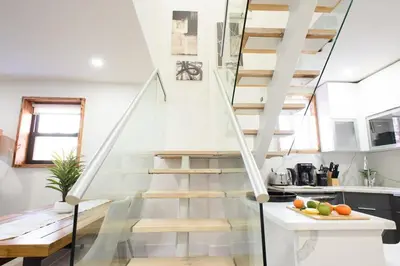 a staircase in a tiny house with a kitchen at 75-5 Luxury 3BR Duplex W d Elevator bldg in New York
