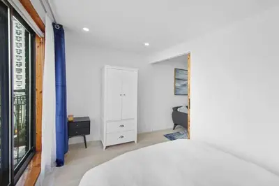 a bedroom with a bed and a dresser and a window at 75-5C 3BR LUXURY Duplex BRAND NEW W&D Elevator in New York