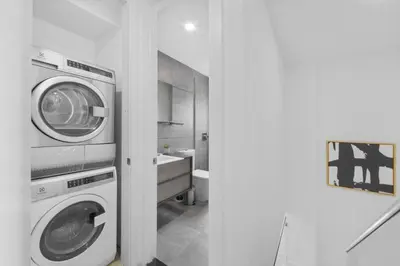 a bathroom with a washer and a washing machine at 75-5C 3BR LUXURY Duplex BRAND NEW W&D Elevator in New York