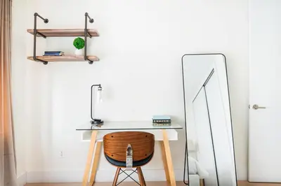 a desk with a chair next to a mirror at 75-4C New Duplex 3BR W D Elevator Walk to C park in New York