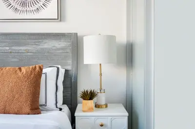 a bedroom with a bed and a lamp on a nightstand at 75-1D New 1BR prime UES W D the unit Best Value in New York