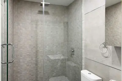 a bathroom with a shower and a toilet at 75-1D New 1BR prime UES W D the unit Best Value in New York