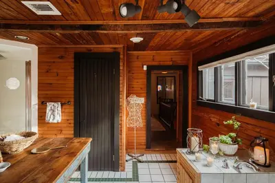 a kitchen with wooden walls and a wooden ceiling at Chestnut Hill Farm in Saugerties