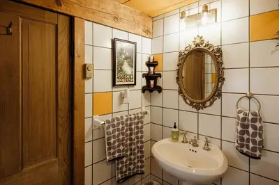 a bathroom with a sink and a mirror at Chestnut Hill Farm in Saugerties