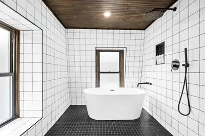 a white bathroom with a tub and a shower at Pine Hill Chateau - Ski Belleayre, Hunter Mountain in Pine Hill