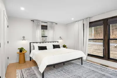 a white bedroom with a bed and a window at Pine Hill Chateau - Ski Belleayre, Hunter Mountain in Pine Hill