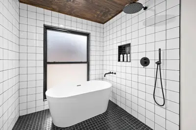 a white bathroom with a tub and a shower at Pine Hill Chateau - Ski Belleayre, Hunter Mountain in Pine Hill