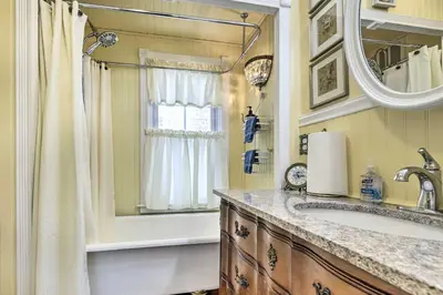 a bathroom with a sink and a mirror at Lakefront Home, Close to Mt Southington! in Wolcott