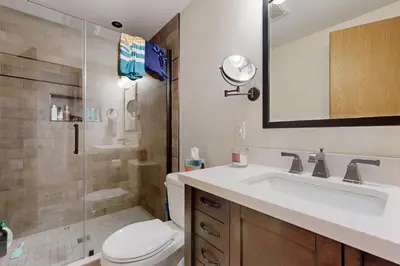 a bathroom with a toilet and a sink and a shower at Green Mountain Escape in Wilmington