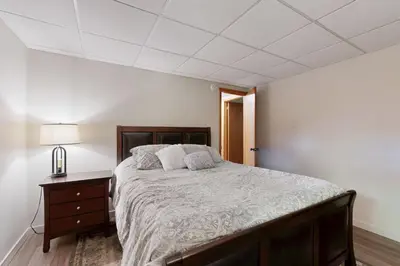 a bedroom with a large bed and a nightstand at Green Mountain Escape in Wilmington