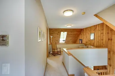 a room with wood paneling and a staircase in a house at Fantastic 2 family vacation home with EV charger in Windham